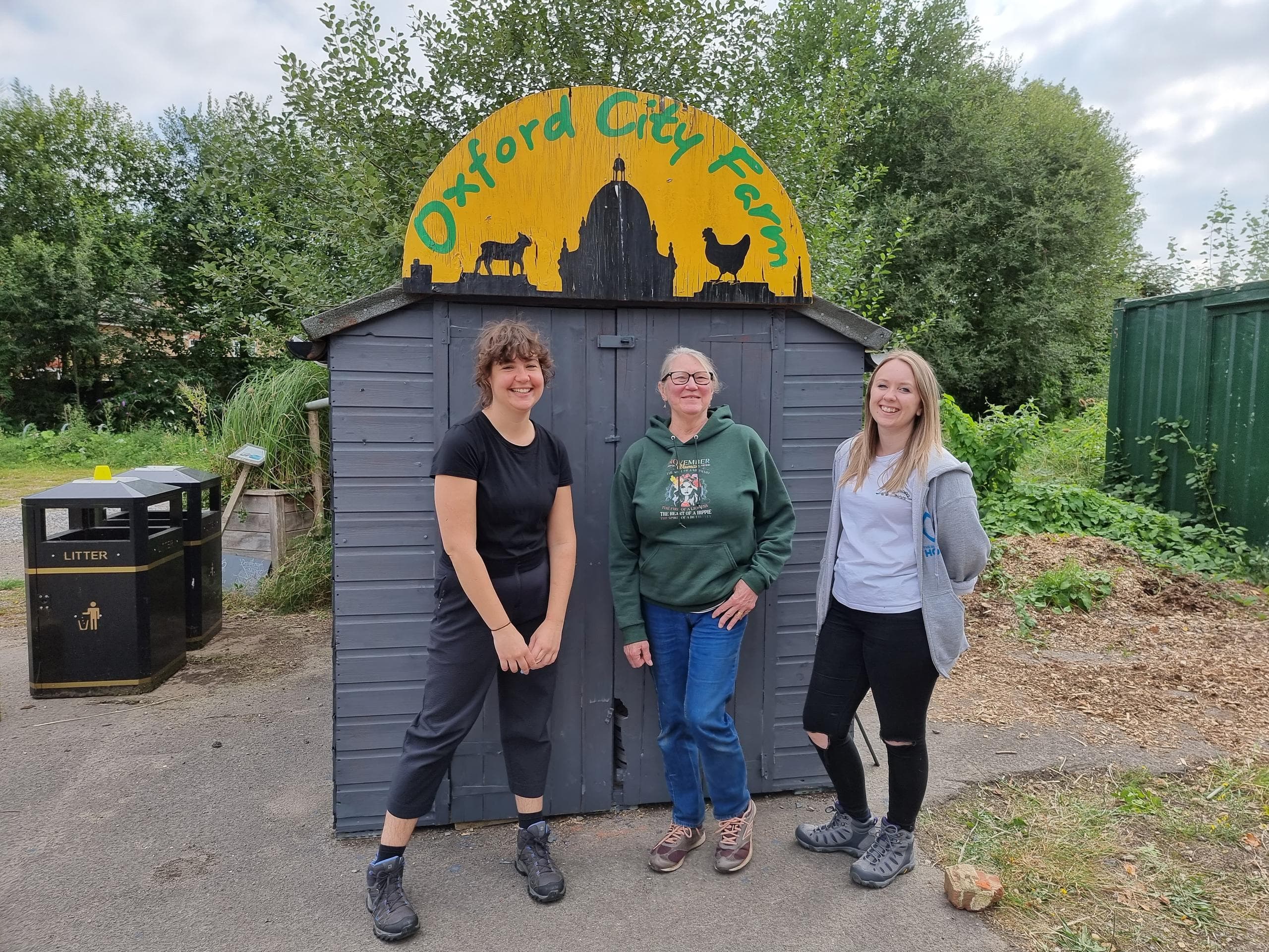 Gemma, Linda and Mel show off the shed's new paintjob
