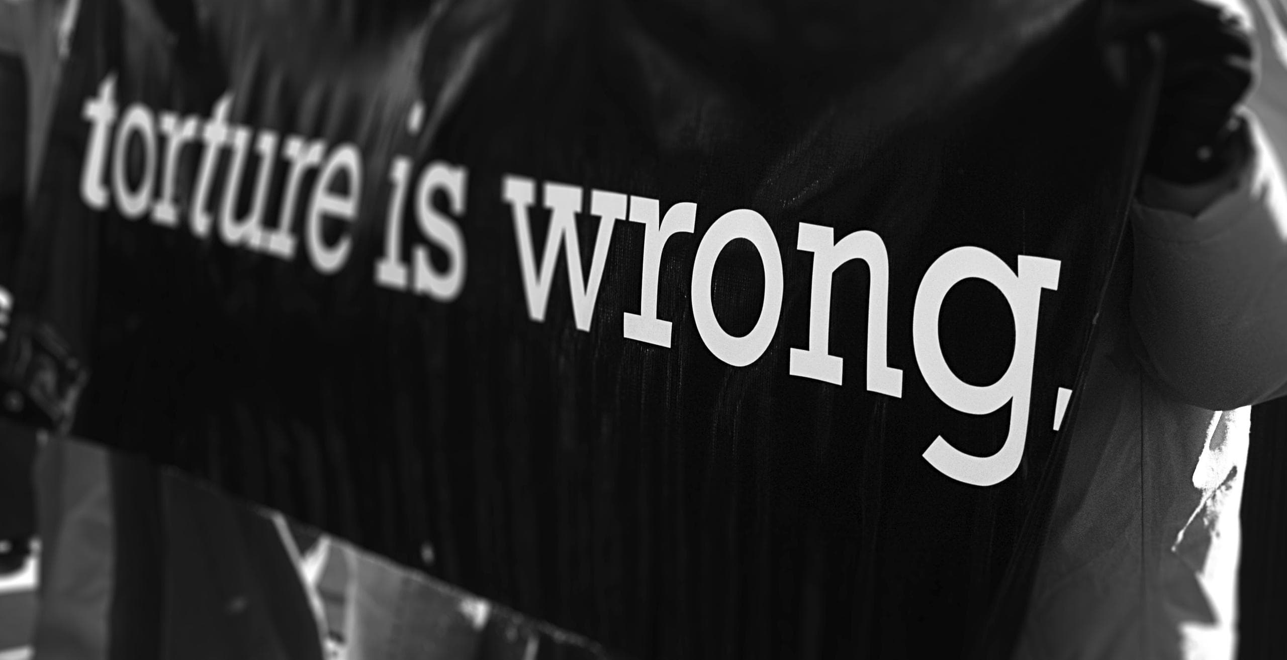 'torture is wrong' banner