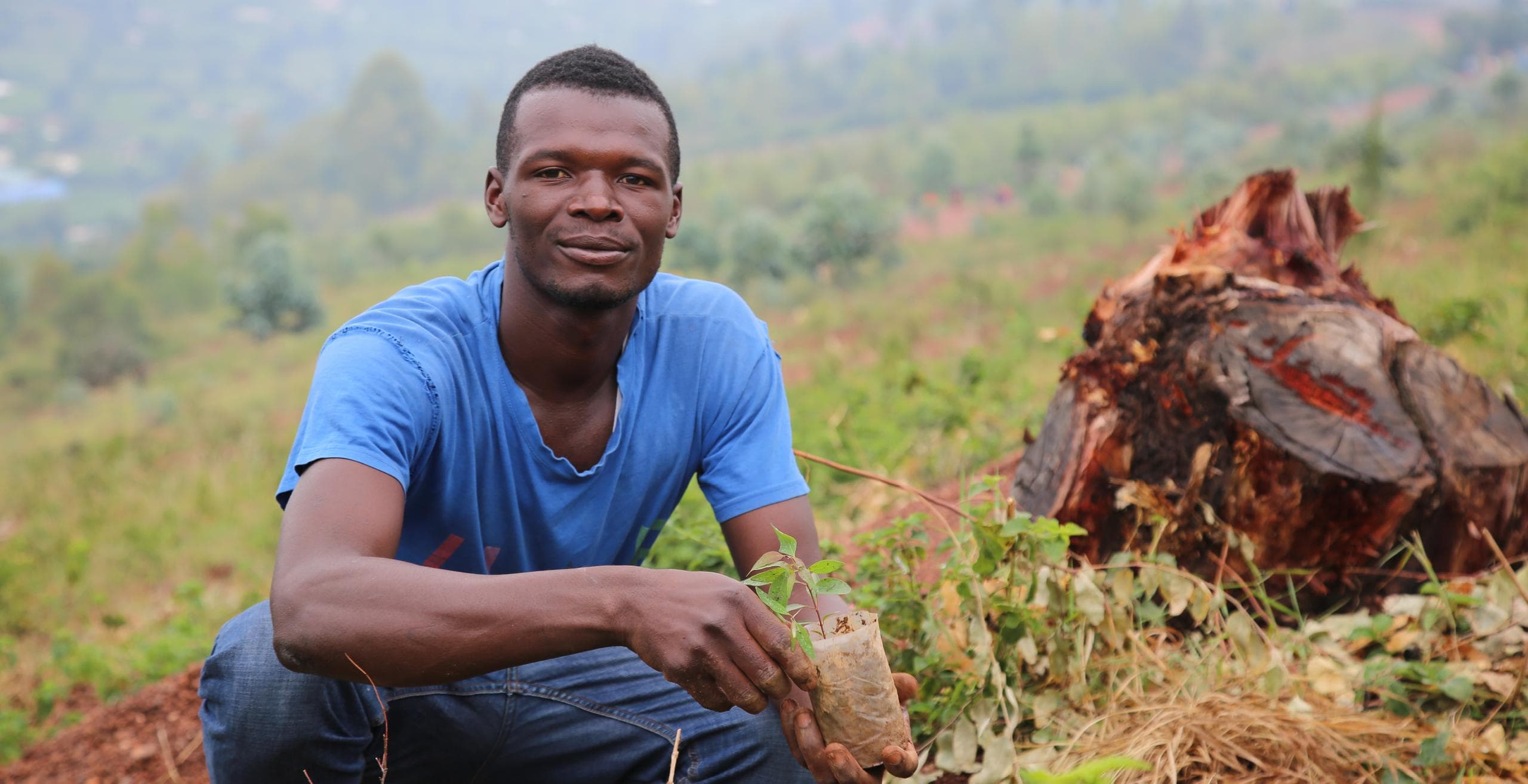 A man planting a tree in Rwanda as part of the launch of 2018/19 Tree Planting Season