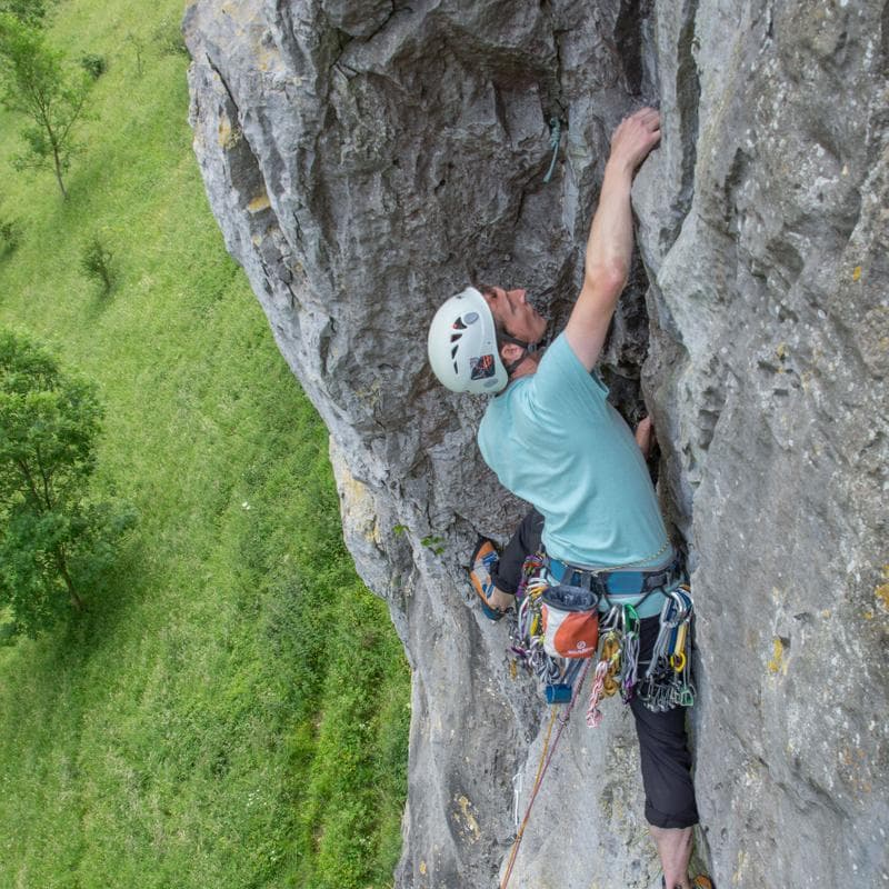 James climbing a cliff