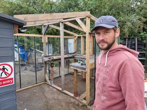 Aaron oversees the greenhouse construction